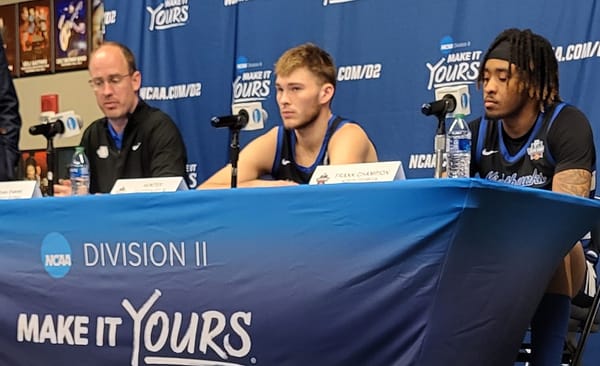 Coach San Evans and players Hunter Shedenhelm and Frank  Champion meet the press post gam